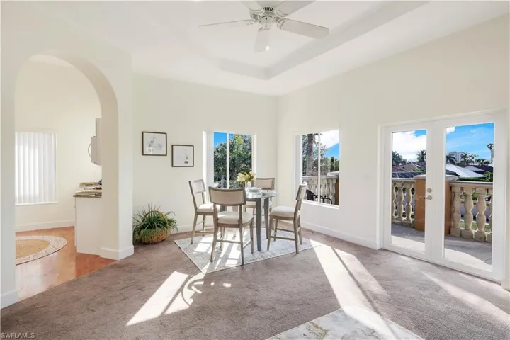 Second-floor dining area with balcony access.