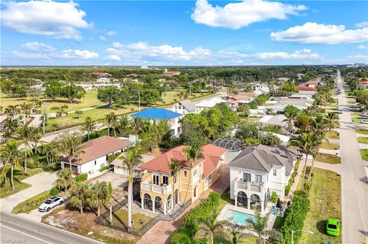Aerial view of residential area featuring a pool