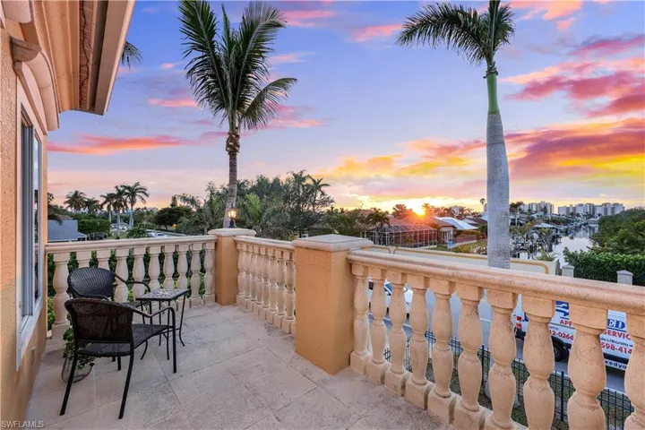 Balcony at dusk with a water view