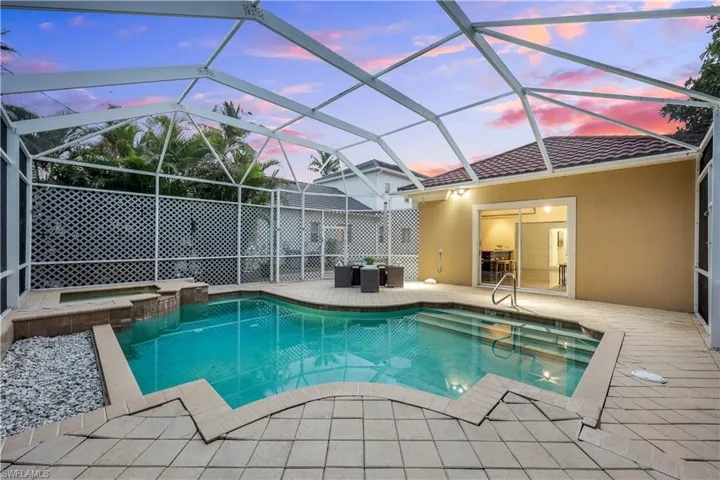 Screened in pool and spa with sundeck and sitting area. Let's get the party started!