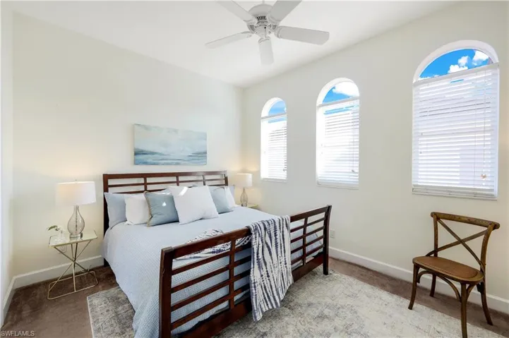 Second-floor primary bedroom with an abundance of natural light.