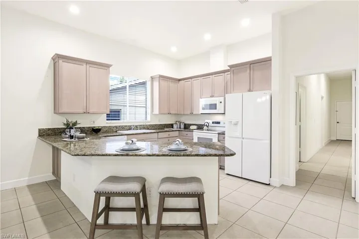 Kitchen with new appliances, and open breakfast bar. Perfect for entertaining.