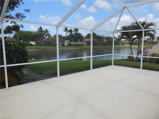 Unfurnished sunroom with a water view