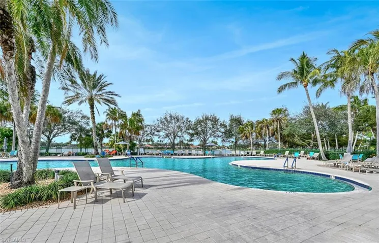 Community pool with a patio