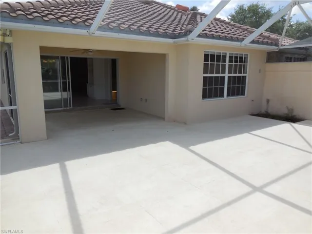View of patio with a lanai