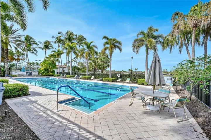 Community pool featuring a patio