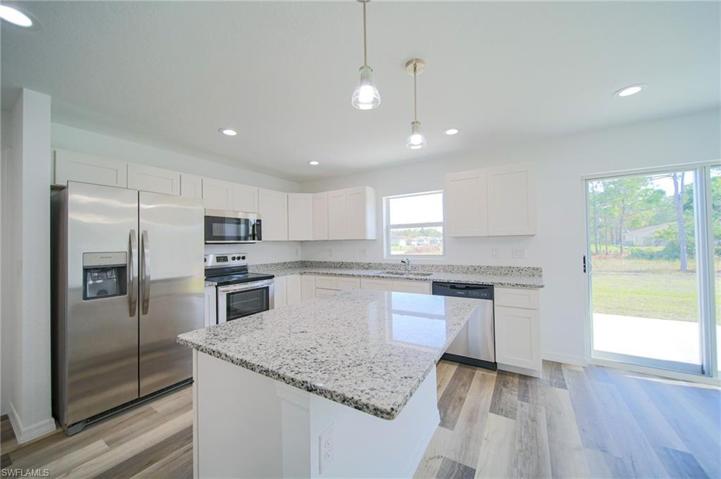 The Island Kitchen Has Granite Countertops, Soft Touch Real Wood Cabinets & Drawers, Stainless Steel Appliances, And An Oversized Walk In Pantry!