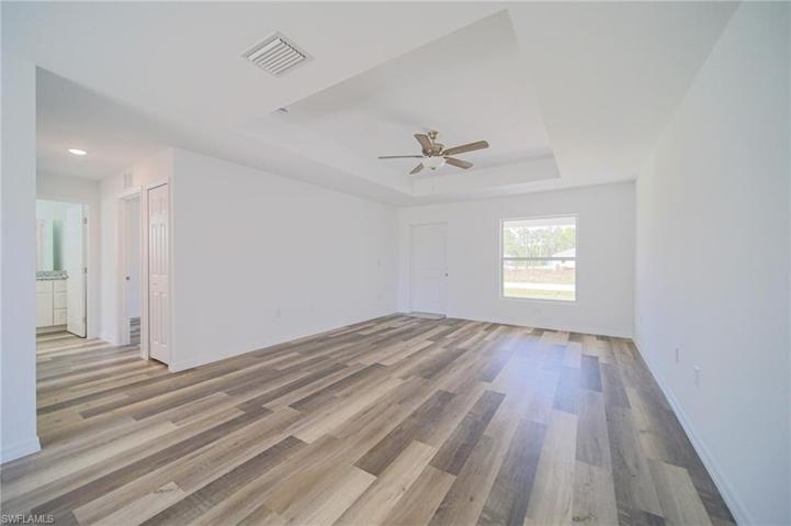 The Living Room Has Trey Ceilings With A Ceiling Fan/Light!