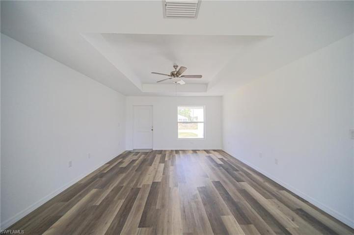 The Living Room Has Trey Ceilings With A Ceiling Fan/Light!