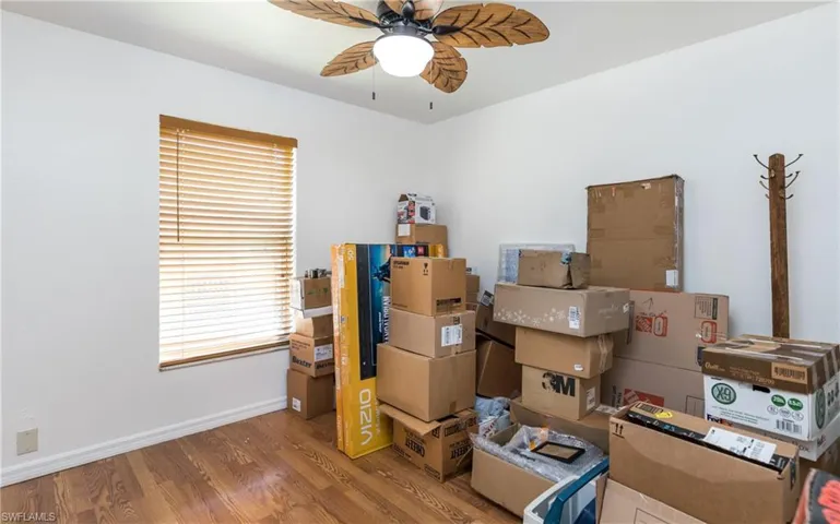 Storage area featuring ceiling fan