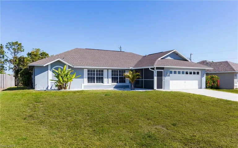 Single story home featuring fence, stucco siding, a front lawn, concrete driveway, and a garage