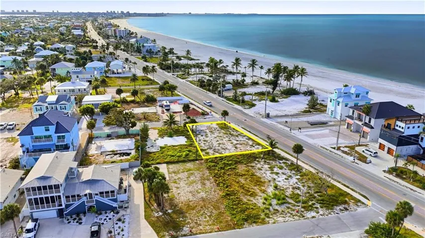 Aerial perspective of suburban area  - Virtually Edited Imagefeaturing property boundaries highlighted and expansive beach