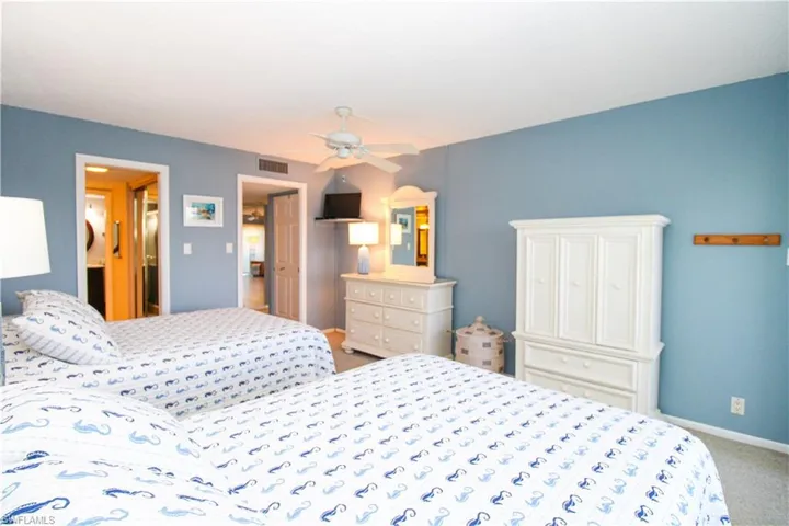 Bedroom featuring carpet, visible vents, ceiling fan, and baseboards