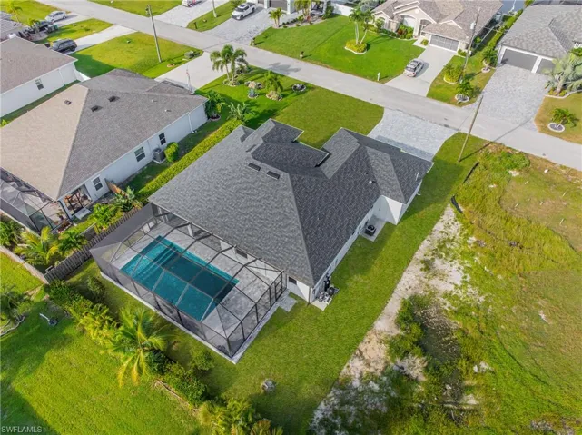 Aerial view of residential area featuring a pool area