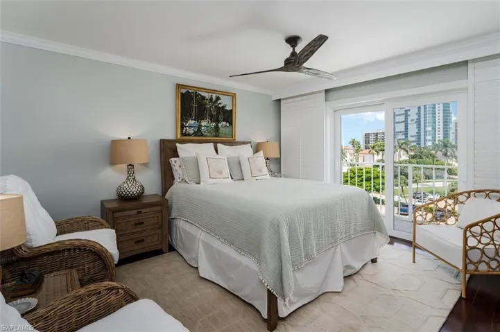 Another Guest Room, with Plantation Shutters, an adjacent Balcony, Crown molding.