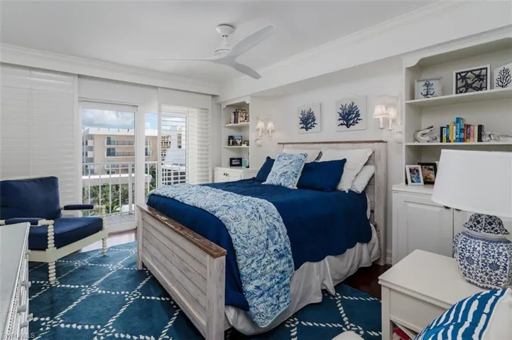 Guest Room with Built in Bookshelves/Cabinets, Plantation Shutters, Balcony, Modern ceiling Fan