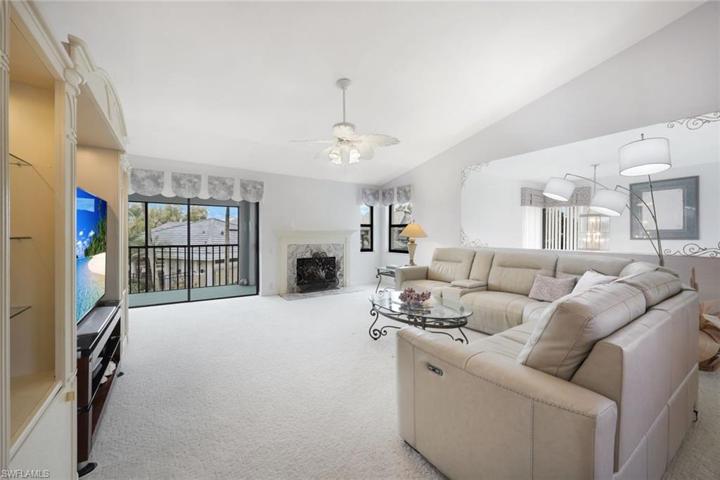 Long View of the Great Room Living Area- Vertical Window Treatments Tuck Away