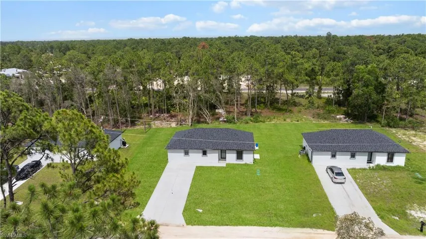 View from above of property featuring a forest