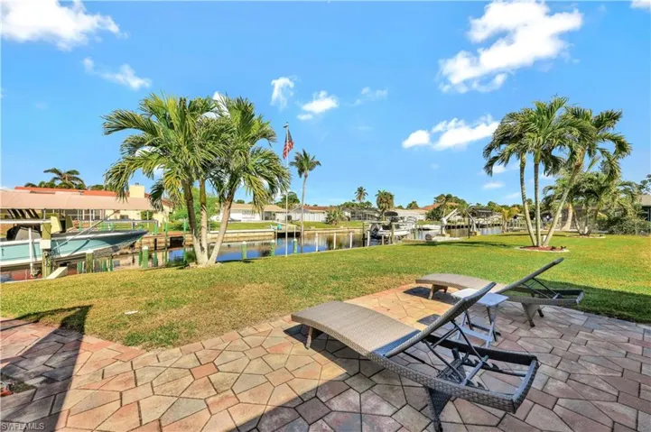 View of patio / terrace featuring a water view and a boat dock