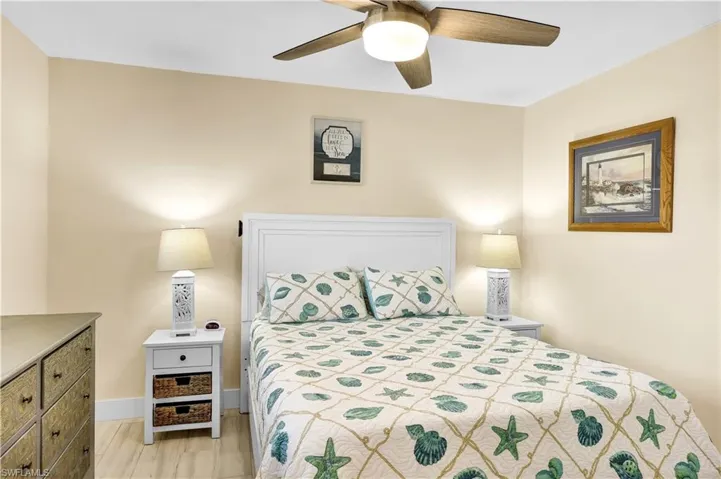 Bedroom with light hardwood / wood-style flooring and ceiling fan