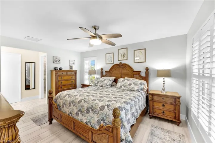 Bedroom with light wood-type flooring and ceiling fan