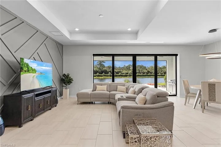 Expansive interior featuring large format tile flooring and a decorative accent wall