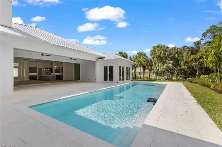 Large swimming pool with natural stone deck.