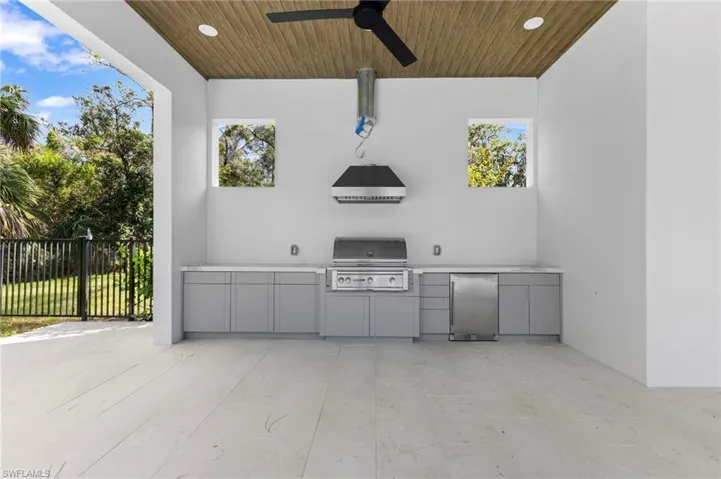 Summer kitchen with gas barbecue. Gas range hood to be completed