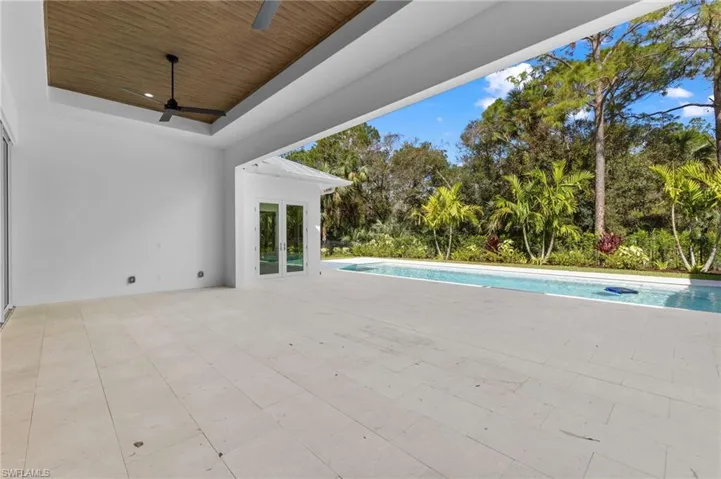 Large covered lanai for your outdoor furniture.