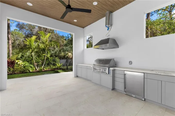Summer kitchen with gas barbecue. Gas range hood to be completed