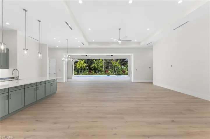 10ft impact sliding doors. Designed with pocketable panels that disappear smoothly into the wall, it creates a wide, unobstructed opening that invites natural light. Authentic Legno Bastone Oak Floors