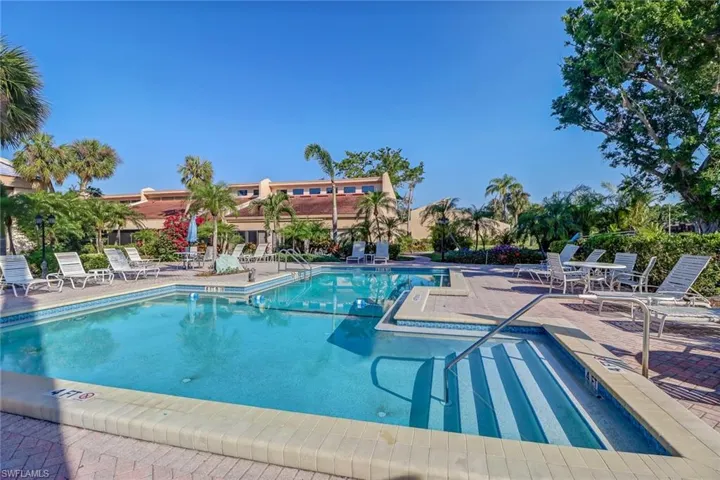 Community pool featuring a patio area
