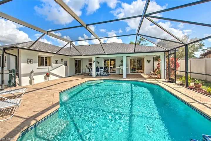 View of pool with a patio and a lanai