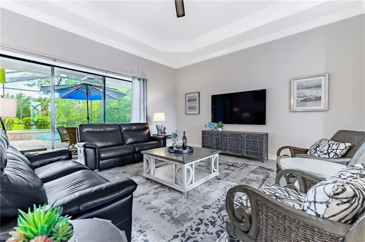 Living room with view of pool area