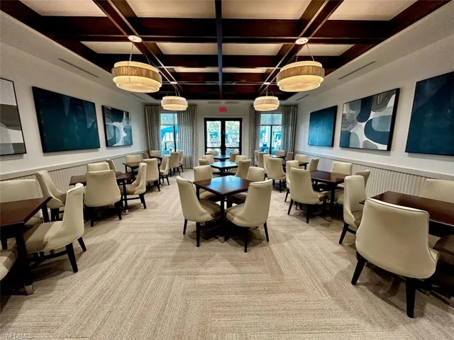 Lobby featuring wainscoting, coffered ceiling, and a decorative wall