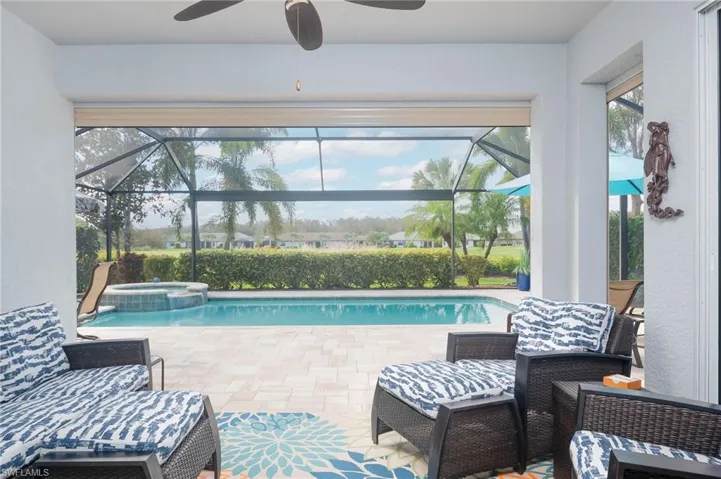 View of pool with an in ground hot tub, and a patio area