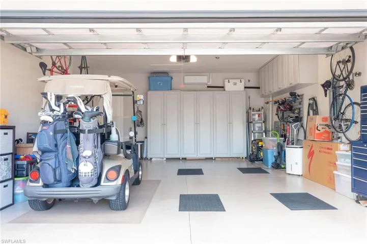 Garage featuring a carport