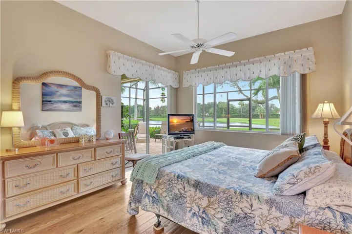 Bedroom featuring light wood-type flooring, ceiling fan, and access to outside