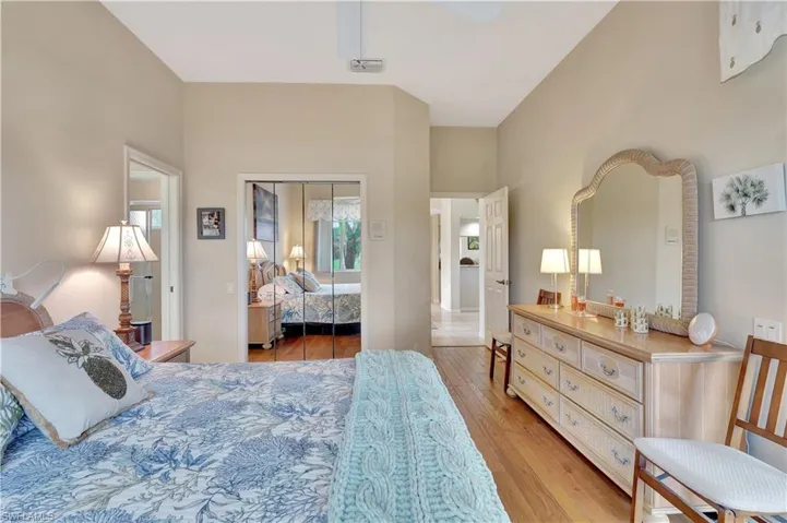 Bedroom with a closet and light hardwood / wood-style floors