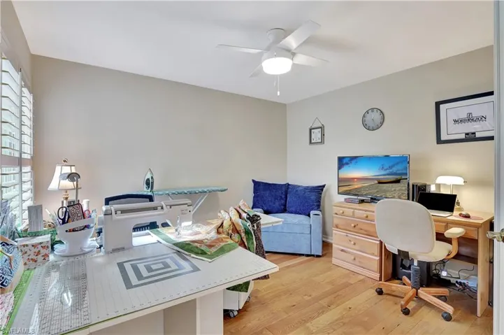 Office space featuring ceiling fan and light wood-type flooring