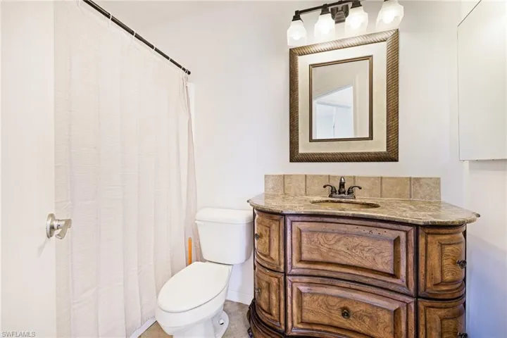 Full bathroom featuring vanity and a shower with shower curtain