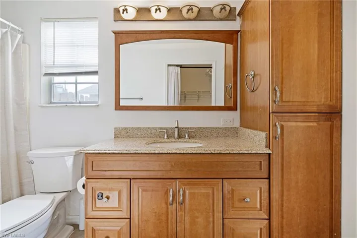 Bathroom with vanity and a shower with curtain