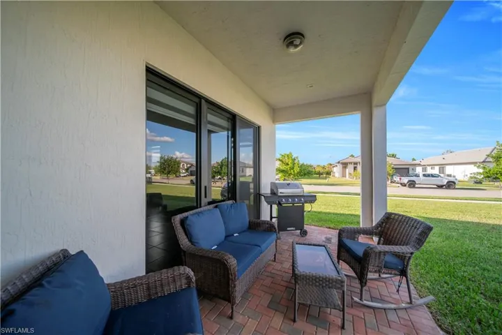 View of patio / terrace featuring area for grilling and a residential view