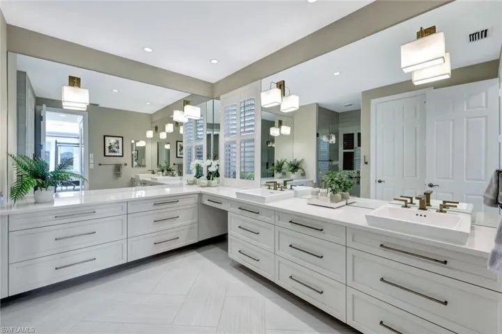 Totally updated Bathroom with tile patterned floors and vanity