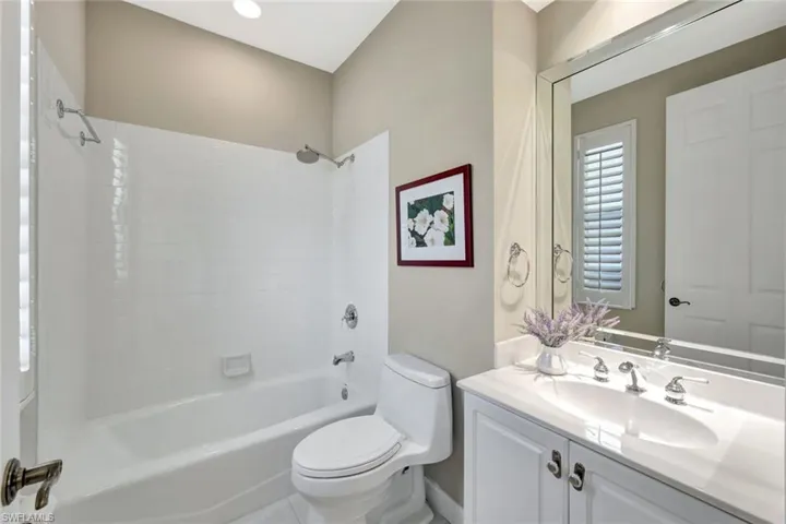 Full bathroom featuring vanity, shower / bathing tub combination, and toilet