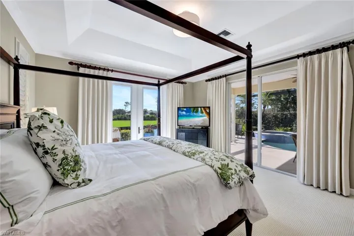 Bedroom with access to exterior and carpet flooring