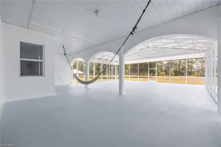 Screened under truss porch area.