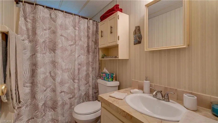 The guest bathroom also features new flooring, a new sink bowl and fixture, a new showerhead, and a new raised toilet (2023).