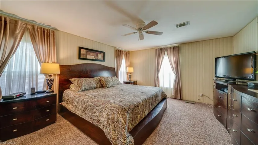 Florida sunshine abounds in this oversized master; complete with a king size bed. Under the bed; more storage.