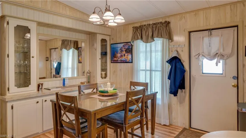 The new flooring (2023) flows into the dining area. Notice the built-ins which provide the opportunity to showcase those special knick-knacks or fine china.